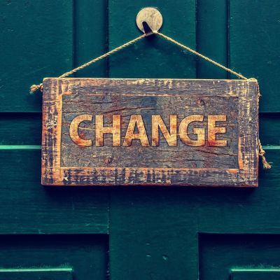 coping with change - sign hanging on a door saying change