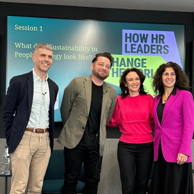 How HR Leaders Change the world image of Tom Emery and panel guests on stage