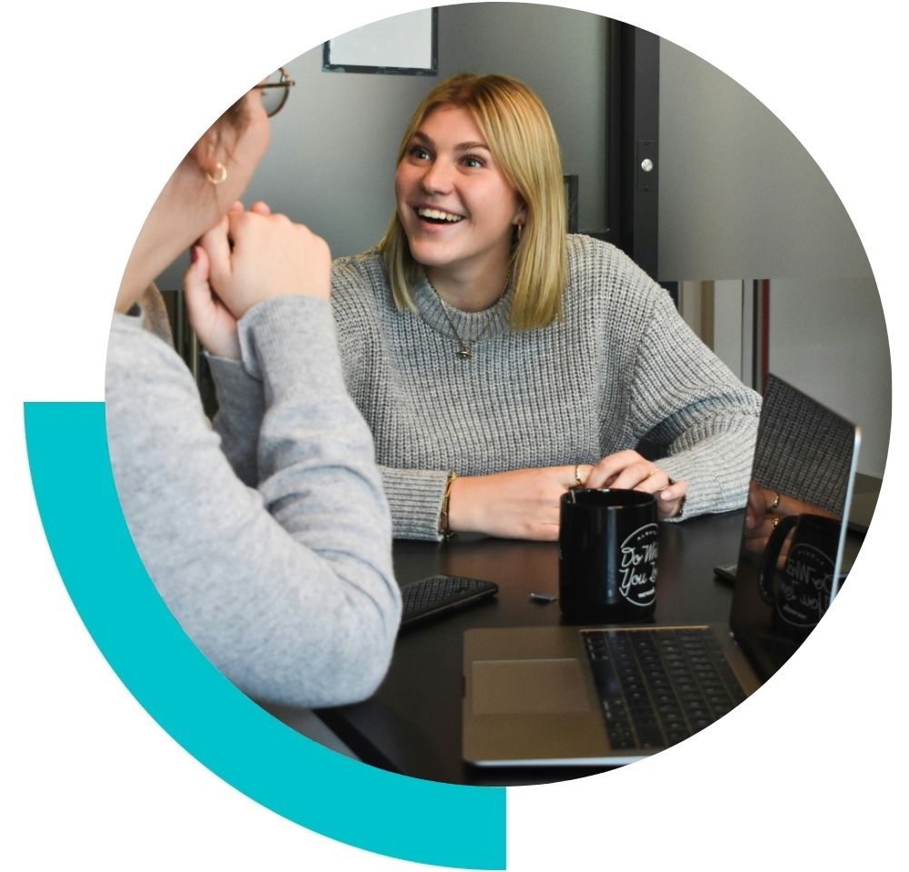 two women in a meeting chatting